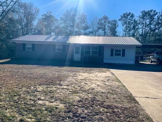 single story home featuring a carport