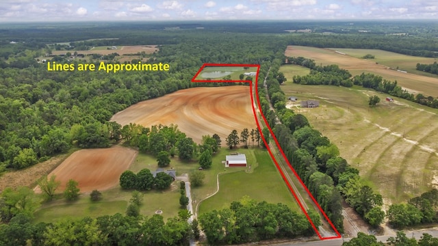 aerial view featuring a rural view and a forest view