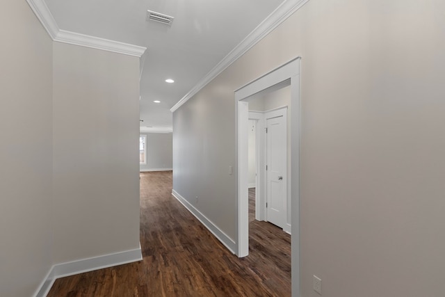 hallway with crown molding and dark hardwood / wood-style flooring