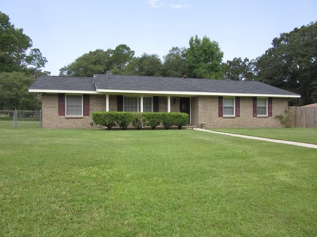 ranch-style home featuring a front yard