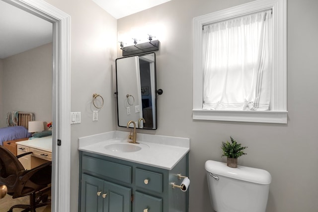 bathroom with toilet and vanity