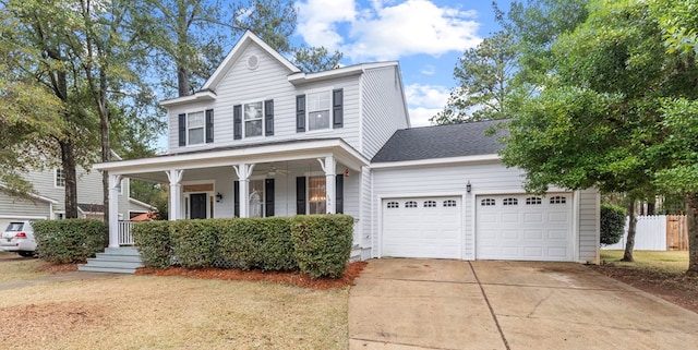 view of front of property featuring a garage and a porch