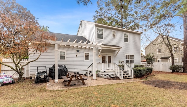 back of property featuring a patio, french doors, a lawn, and a pergola