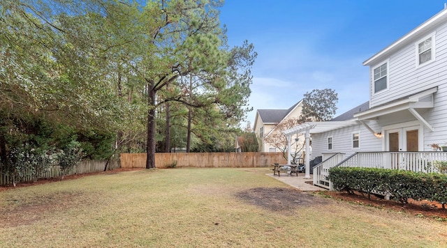 view of yard with a patio, a deck, french doors, and a pergola