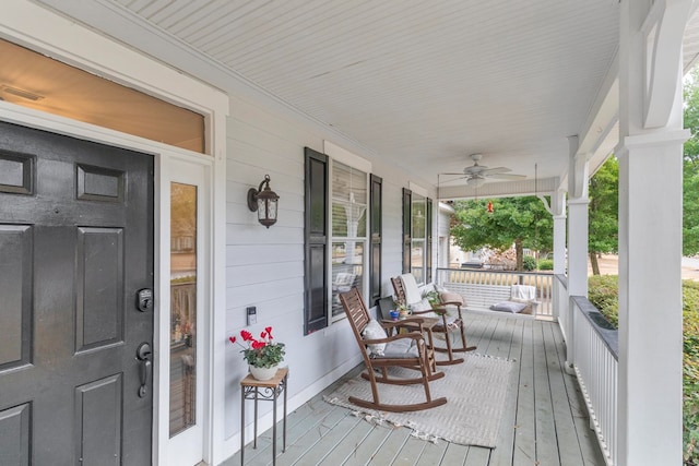 deck featuring a porch and ceiling fan