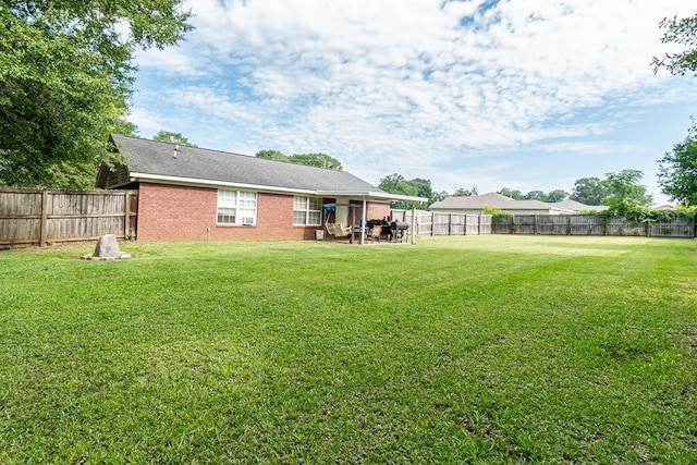52 Oakwood Dr, Midland City, AL 36350 - fenced backyard with a patio area