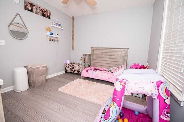 52 Oakwood Dr, Midland City, AL 36350 - bedroom with wood finished floors and a ceiling fan