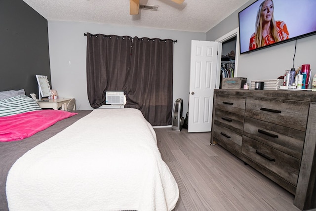 52 Oakwood Dr, Midland City, AL 36350 - bedroom with wood finished floors, a textured ceiling, and ceiling fan