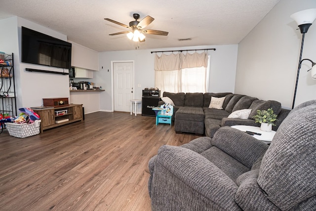52 Oakwood Dr, Midland City, AL 36350 - living room featuring wood finished floors, a ceiling fan, and a textured ceiling