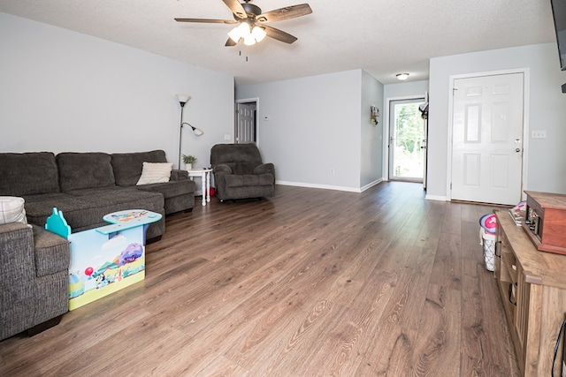 52 Oakwood Dr, Midland City, AL 36350 - living room with a ceiling fan, dark wood finished floors, and a textured ceiling