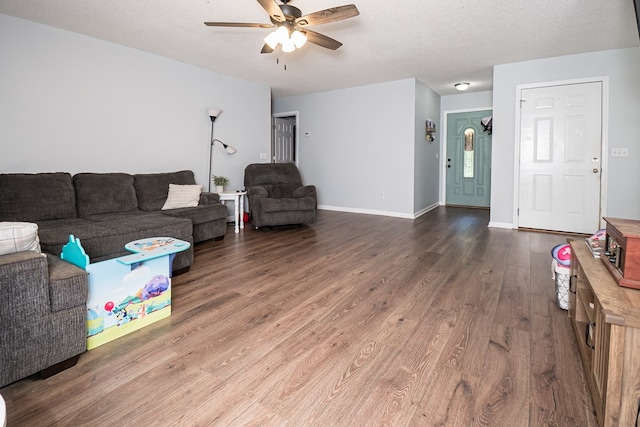 52 Oakwood Dr, Midland City, AL 36350 - living area with a ceiling fan and dark wood-style floors