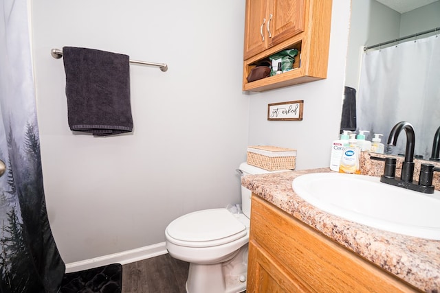 52 Oakwood Dr, Midland City, AL 36350 - full bath with vanity, wood finished floors, and a shower with curtain