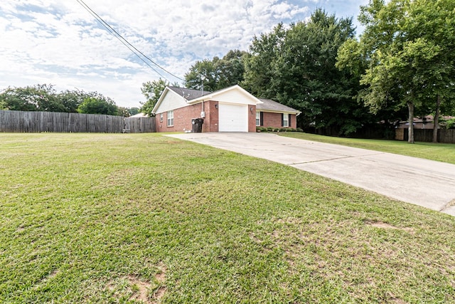 52 Oakwood Dr, Midland City, AL 36350 - view of yard with concrete driveway and a garage