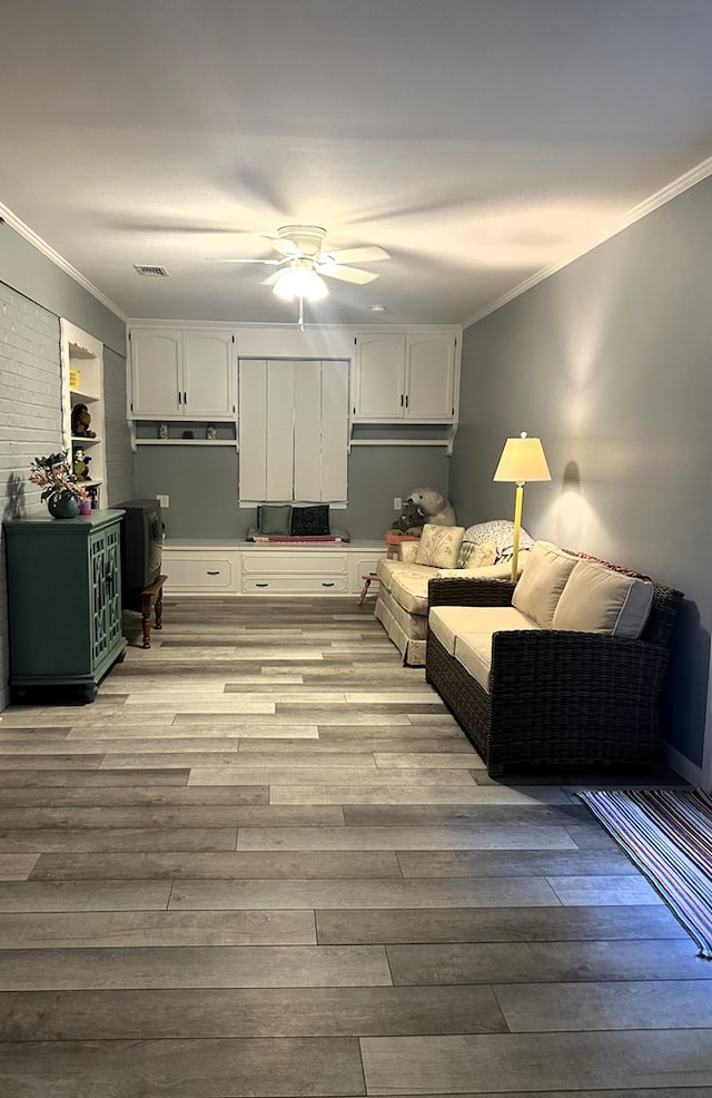 1712 Sowell Rd, Brewton, AL 36426 - living area featuring ceiling fan, ornamental molding, and light hardwood / wood-style flooring