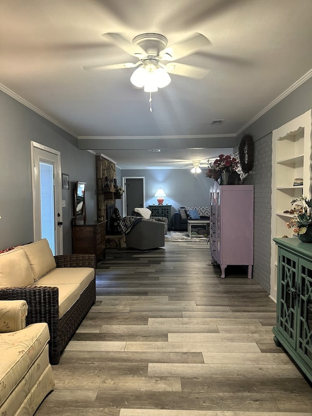 1712 Sowell Rd, Brewton, AL 36426 - living room featuring built in shelves, ceiling fan, hardwood / wood-style floors, and ornamental molding