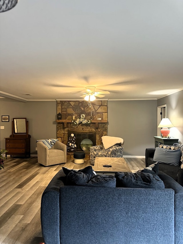 1712 Sowell Rd, Brewton, AL 36426 - living room with a stone fireplace, ceiling fan, and hardwood / wood-style floors