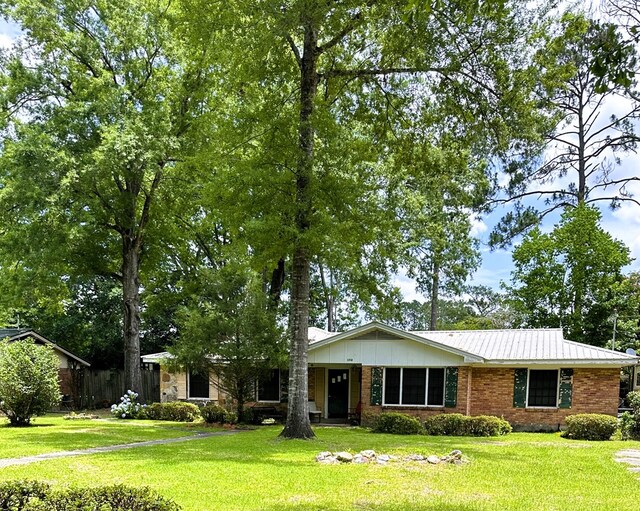 1712 Sowell Rd, Brewton, AL 36426 - ranch-style house with a front yard