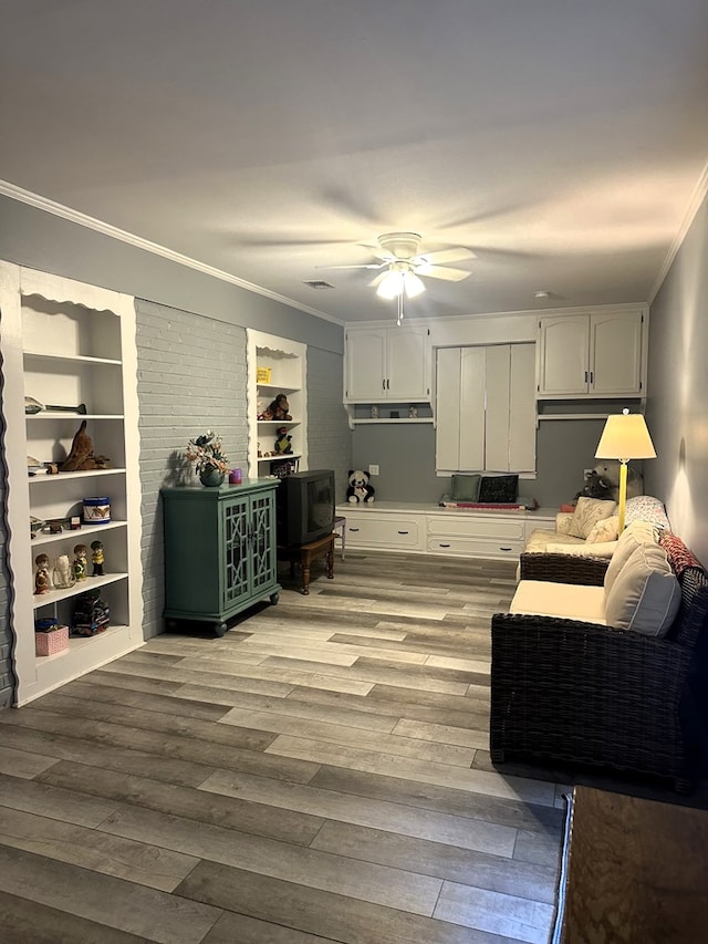 1712 Sowell Rd, Brewton, AL 36426 - interior space with white cabinetry, crown molding, ceiling fan, and light wood-type flooring