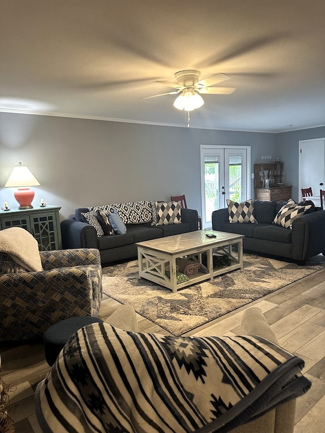 living room featuring ceiling fan, light wood-type flooring, and french doors