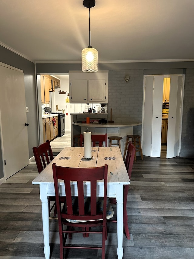 1712 Sowell Rd, Brewton, AL 36426 - dining room featuring ornamental molding and dark wood-type flooring
