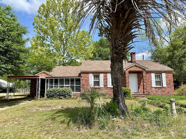 6537 E State Highway 52, Hartford, AL 36344 - single story home with a chimney, roof with shingles, a front lawn, brick siding, and a sunroom