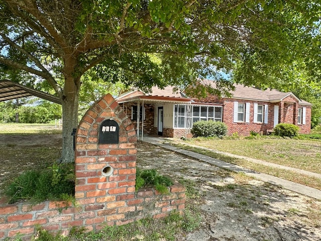 6537 E State Highway 52, Hartford, AL 36344 - view of front of home with a front lawn, a carport, and brick siding