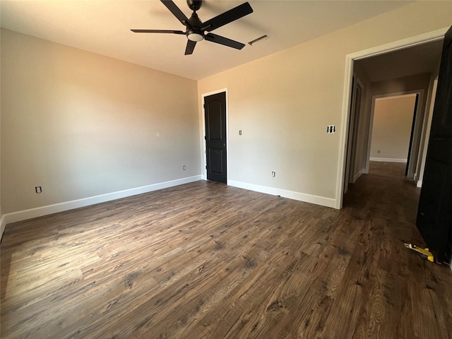 729 Sandstone Dr, Dothan, AL 36303 - spare room featuring dark wood-style flooring, ceiling fan, and baseboards