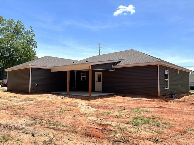 729 Sandstone Dr, Dothan, AL 36303 - back of house featuring roof with shingles and a patio area