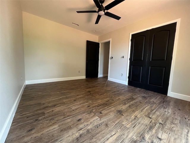 729 Sandstone Dr, Dothan, AL 36303 - unfurnished bedroom with dark wood finished floors, baseboards, a closet, and ceiling fan