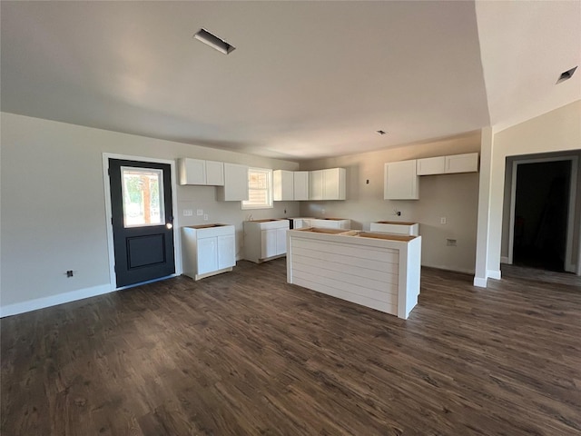 729 Sandstone Dr, Dothan, AL 36303 - kitchen featuring dark wood-type flooring, white cabinets, a center island, and baseboards