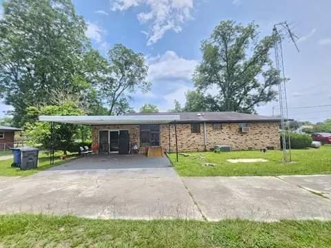 8159 State Highway 10, Shorterville, AL 36373 - exterior space featuring a carport, an attached garage, and driveway
