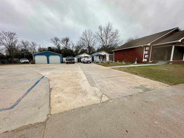 view of road with concrete driveway