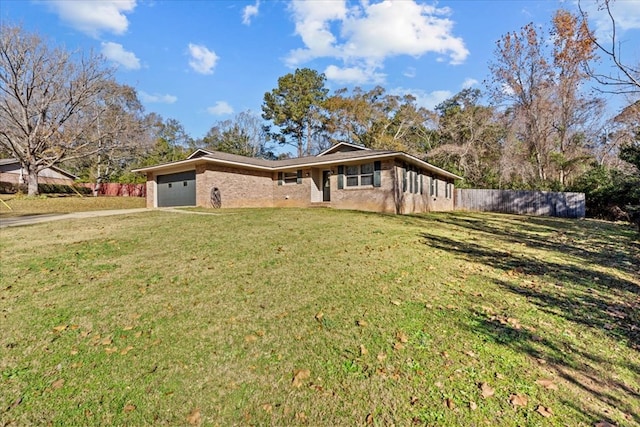 ranch-style home featuring a front lawn and a garage