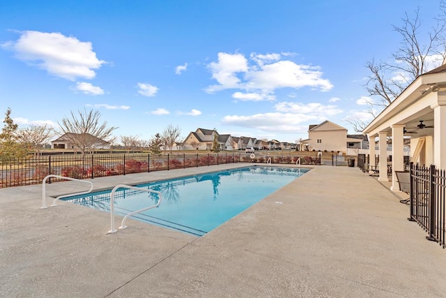 view of swimming pool with a patio area and ceiling fan