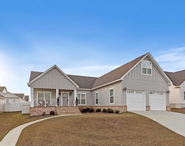 craftsman-style house featuring a front yard and a garage