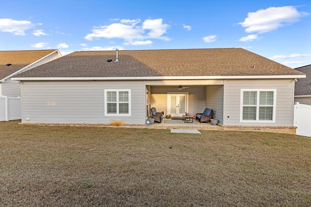 back of house with a patio area, ceiling fan, and a yard