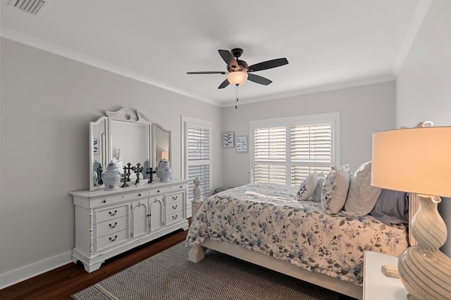 bedroom featuring ornamental molding, dark hardwood / wood-style flooring, and ceiling fan