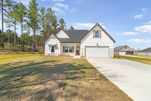 modern farmhouse style home featuring driveway, a shingled roof, a front yard, board and batten siding, and brick siding