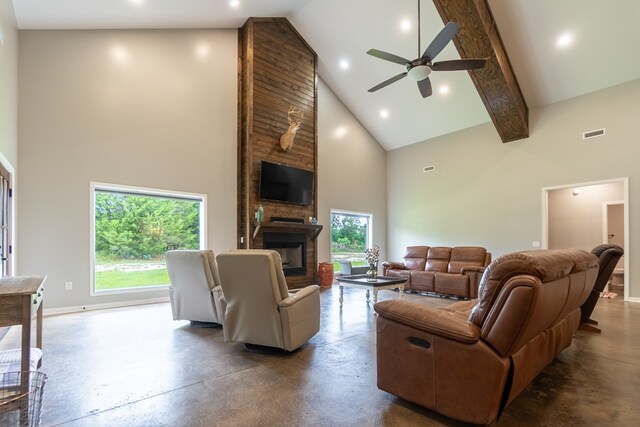 97 Eudon Best Rd, Ashford, AL 36312 - living room with high vaulted ceiling, finished concrete flooring, recessed lighting, baseboards, and a fireplace