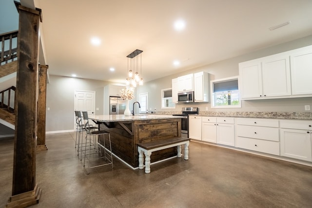 97 Eudon Best Rd, Ashford, AL 36312 - kitchen with appliances with stainless steel finishes, concrete floors, light stone counters, white cabinets, and recessed lighting