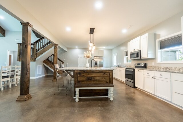 97 Eudon Best Rd, Ashford, AL 36312 - kitchen featuring appliances with stainless steel finishes, finished concrete floors, light stone countertops, white cabinets, and recessed lighting