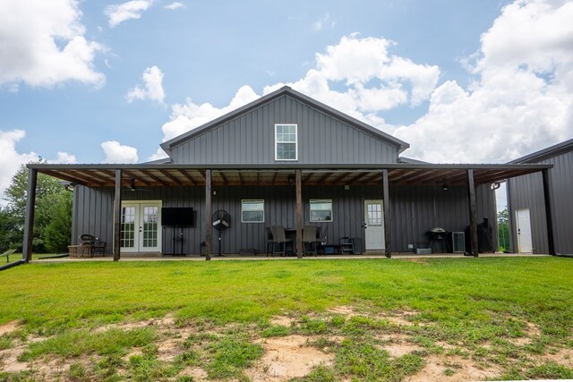 97 Eudon Best Rd, Ashford, AL 36312 - rear view of property with french doors, board and batten siding, a lawn, and a patio