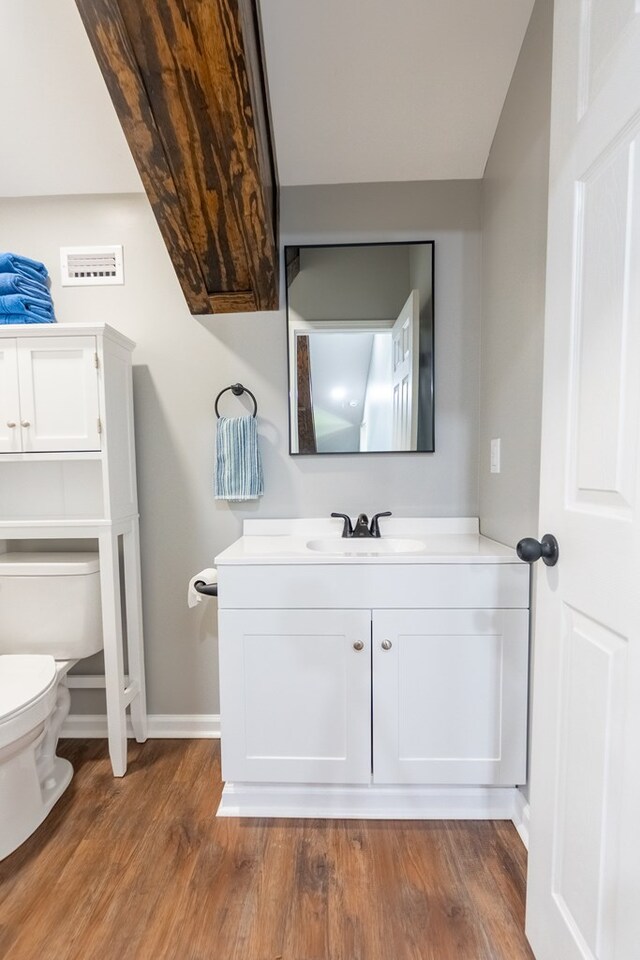 97 Eudon Best Rd, Ashford, AL 36312 - bathroom with toilet, vanity, wood finished floors, and baseboards