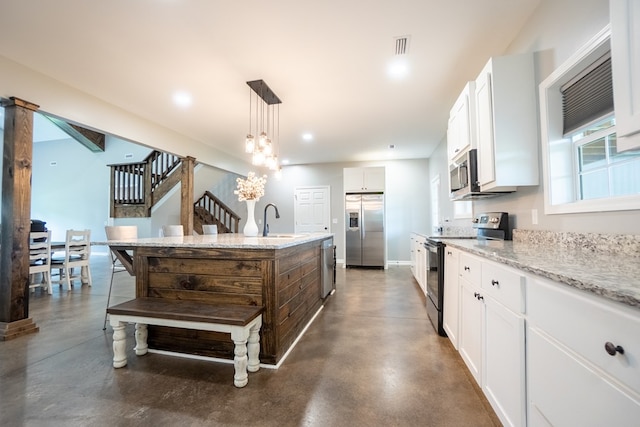 97 Eudon Best Rd, Ashford, AL 36312 - kitchen with stainless steel appliances, finished concrete floors, a sink, a kitchen island with sink, and recessed lighting