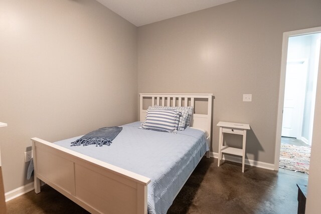 97 Eudon Best Rd, Ashford, AL 36312 - bedroom with finished concrete floors and baseboards