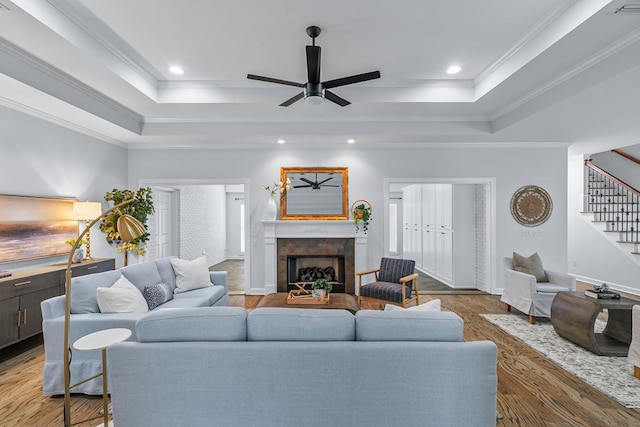 401 Gladstone Way, Dothan, AL 36303 - living area featuring stairs, a tray ceiling, ceiling fan, wood finished floors, and ornamental molding