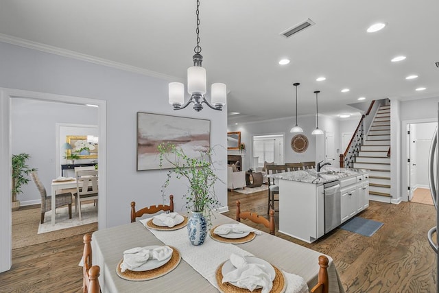 401 Gladstone Way, Dothan, AL 36303 - dining area featuring ornamental molding, dark wood-style floors, recessed lighting, stairway, and a chandelier