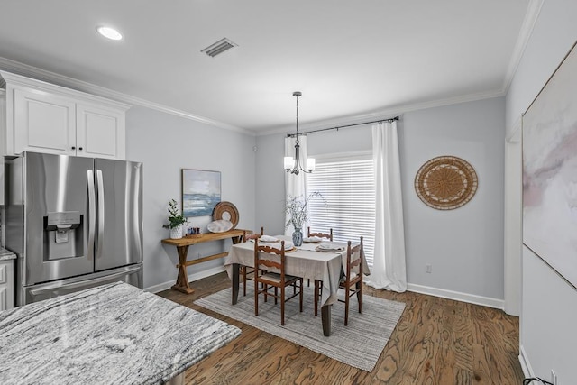 401 Gladstone Way, Dothan, AL 36303 - dining area featuring ornamental molding, a chandelier, and dark wood-style floors