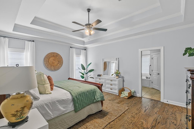 401 Gladstone Way, Dothan, AL 36303 - bedroom featuring a raised ceiling, ornamental molding, wood finished floors, ceiling fan, and connected bathroom