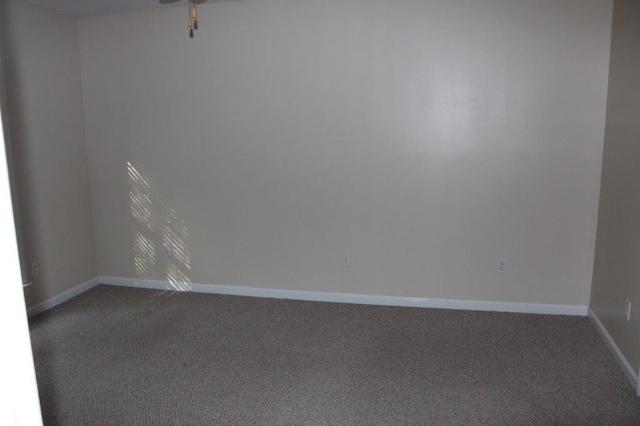 empty room with carpet and ceiling fan